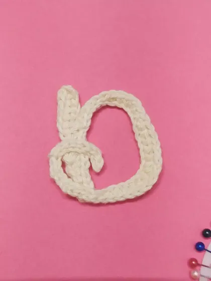 Next up is 'D'. Some letters are more challenging than others, but I believe practice leads to perfection. This one has a cute bunny-ear detail.