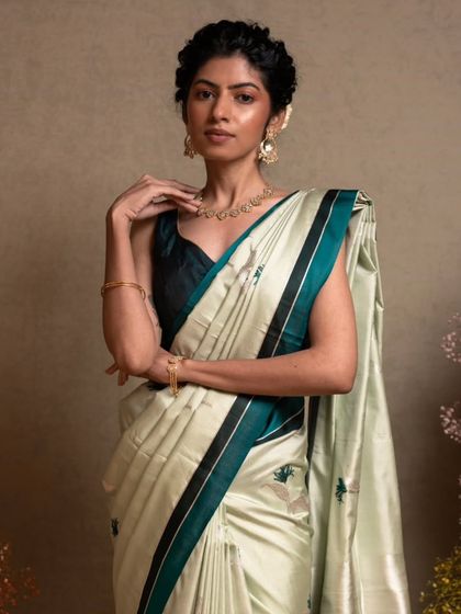 A closer look at the elegant drape of the Banarasi kathan silk, a fabric known for its softness and richness.