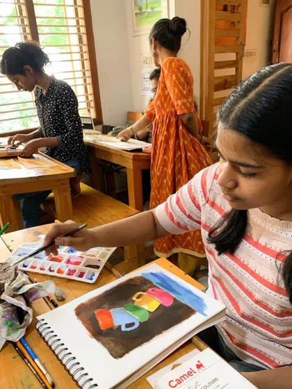 A classroom view of students working on their acrylic paintings. Even in a group setting, each artist is on their own creative journey.