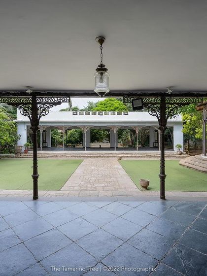 A wide-angle view from the pavilion, showing the expansive lawn leading to the bandstand, ideal for large wedding ceremonies.