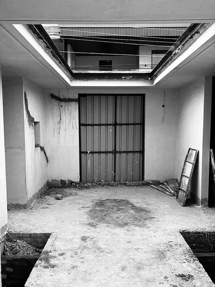 The journey to the final vision begins here. This is the raw construction site of the entrance, showing the initial groundwork for the water bodies and the basic structure before the luxury finishes are applied.