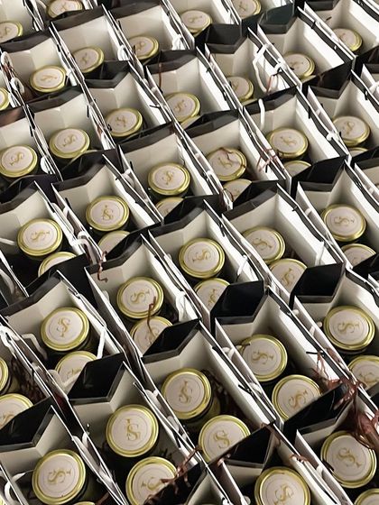 A view of the assembly line for a large order of engagement return gifts. We ensure every single gift is packed with care and precision.