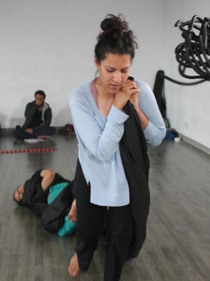 A photo from a research session for 'The Breath Way', a workshop I co-facilitated. This shows my work in an educational setting, exploring creativity through bodywork, material play, and breath.