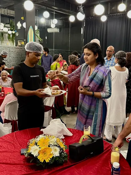 Our catering staff serving guests during an event, highlighting the seamless service we provide.