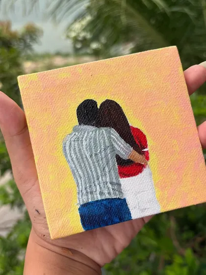 A small, simple, and sweet faceless portrait of a couple hugging, painted on a mini canvas. These are great for desks or small shelves.
