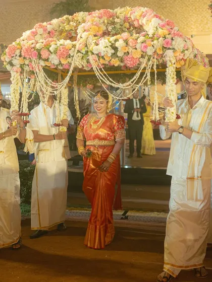 The bride's entry under a 'phoolon ki chaadar' (canopy of flowers), a beautiful and emotional tradition in Indian weddings that I love to orchestrate.