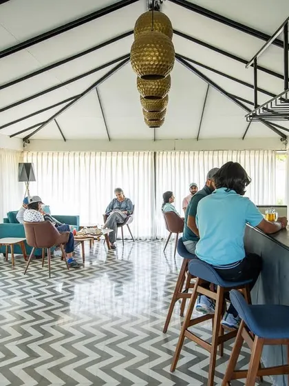 After your game, unwind in our modern clubhouse. The bar and lounge area is the perfect spot to relax, grab a drink, and discuss the day's best shots with fellow golfers.