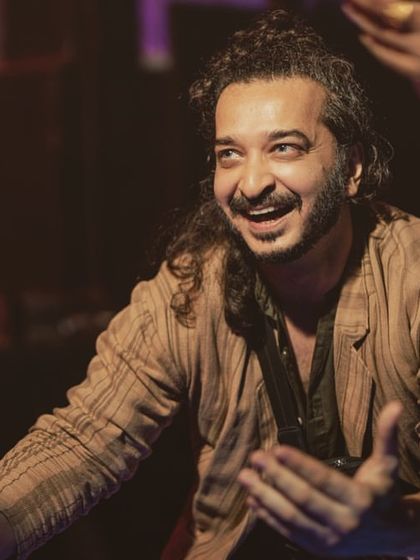 A candid black and white photo, sharing a happy moment with music director Pritam.