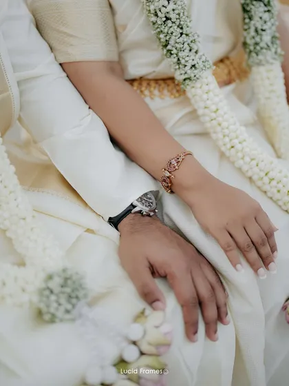 A close-up on their intertwined hands, a simple yet powerful symbol of their new union. We believe in capturing the details that matter.