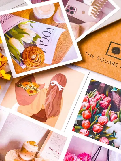 A flatlay of aesthetic photo prints from The Square Prints, creating a collage effect. This is a great way to show the variety and quality of the prints.