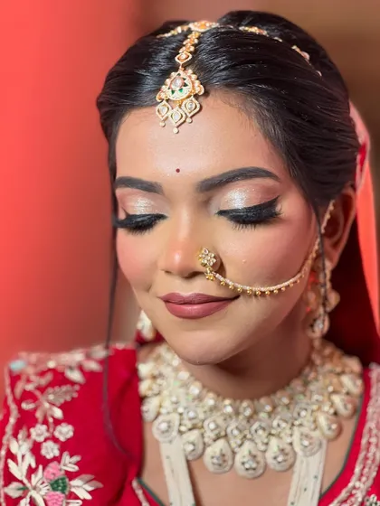 A close-up of the bride's makeup, featuring shimmery eyelids and a perfectly defined lip.