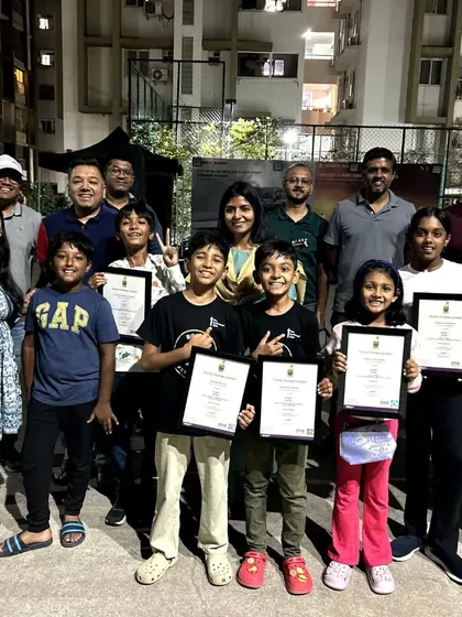 A group photo from our "Champion's Meet" in Hyderabad. Our students and their proud parents gather together, holding certificates from Trinity College London. This is the supportive community that fuels our students' success.