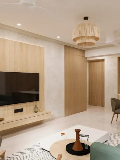 We create warm and inviting living spaces perfect for family time. This living room showcases a Japandi-inspired design with natural wood tones, a comfortable green sofa, and soft, ambient lighting, proving that modern home interiors can also be cozy and welcoming.