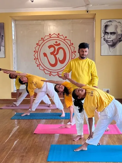Our beginner classes are held in a bright and welcoming space, with portraits of our gurus, Swami Sivananda and Swami Vishnudevananda, creating a serene atmosphere for practice.