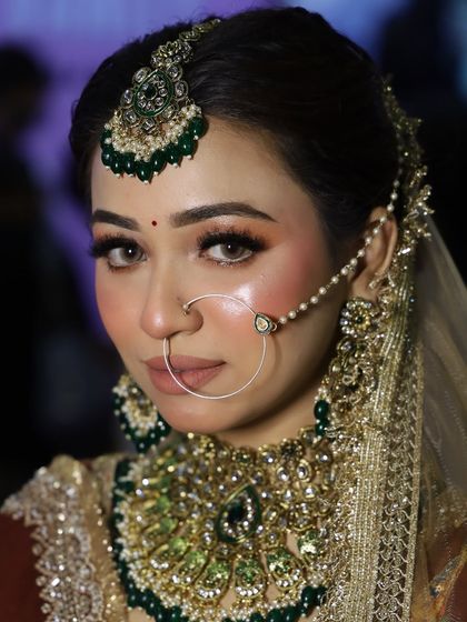 A final portrait from the beauty expo, highlighting the flawless skin and the intricate details of the jewelry and makeup.