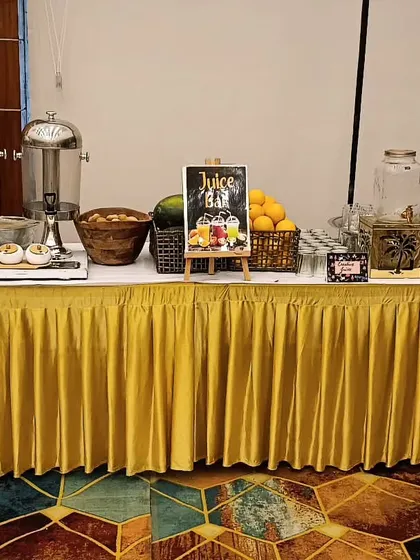 A combined juice bar and pani puri setup for a large event. Offering a variety of live counters is a great way to give your guests multiple delicious and interactive options.