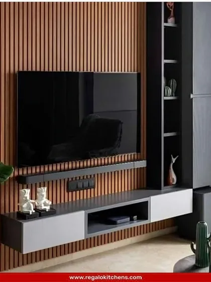 A stylish TV unit with a fluted wood back panel and an asymmetrical shelving unit. This design is perfect for adding texture and functional display space to a living room.