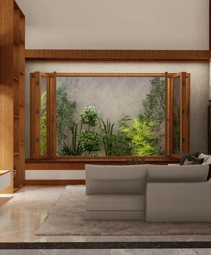 This view captures the serene and natural feel of the living space, with its earthy tones and view of the lush garden.