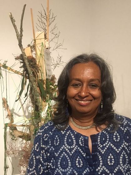 Celebrating artist Ayisha Abraham on her birthday. She is seen here with one of her unique, nature-based assemblages.