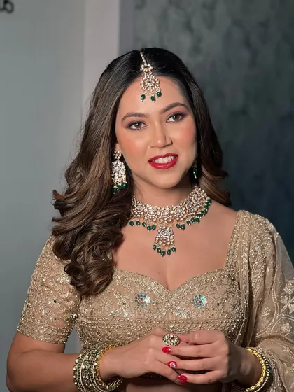 A confident and happy portrait of the bride, her smile lighting up the room.