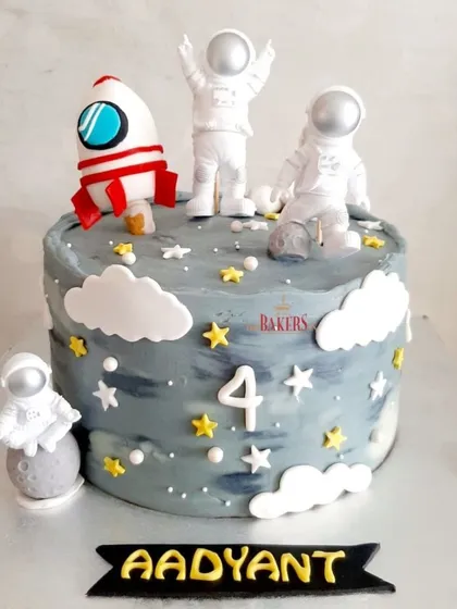 Aadyant is fascinated with space, and for the last two years, I've made him a space-themed cake. This minimal-fondant version features non-edible astronaut toys that he can play with later.