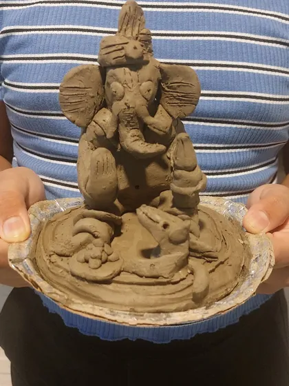 A close-up of a beautifully sculpted Ganesha, complete with a tiny mouse and modak. The fine details show the level of engagement and skill the children develop during our sessions.