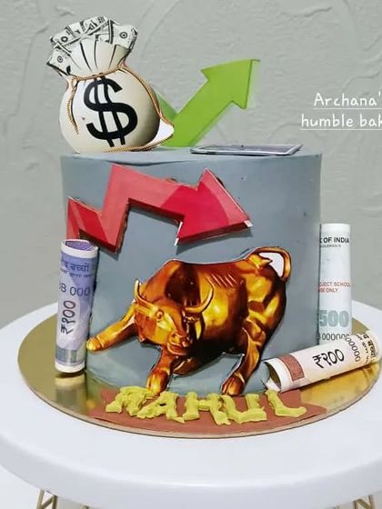 Another take on a stock market theme, this cake features a bull, stock charts, and edible Indian currency notes.