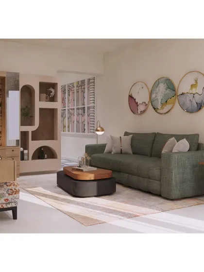 This angle showcases the decorative elements, including the circular wall art and pendant lights that complement the green sofa and patterned ottoman, adding personality to the room.