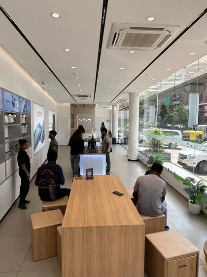 A wide view of a completed Vivo showroom, designed to feel open and welcoming. The large glass facade allows for plenty of natural light and gives a clear view of the store's interior from the outside, attracting foot traffic.