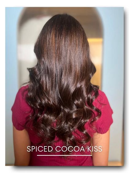 'Spiced Cocoa Kiss' is a rich, dark brown with a hint of warm spice. This color adds incredible depth and shine, making it a perfect choice for a dramatic yet natural looking transformation.
