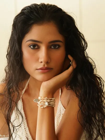 A close-up portrait that captures the essence of the look: dewy skin, defined eyes, and a natural, effortless beauty.