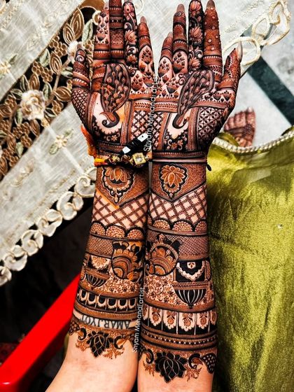 A full view of the previous design, showcasing the dense and detailed work from palms to elbows.