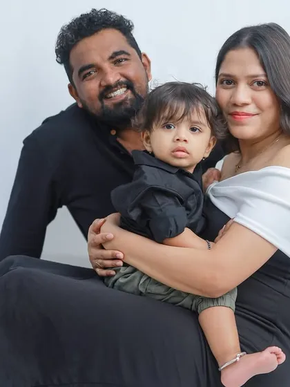 A close-up of a family cuddle. The focus here is on the expressions and the feeling of closeness, creating an intimate and heartwarming family portrait.