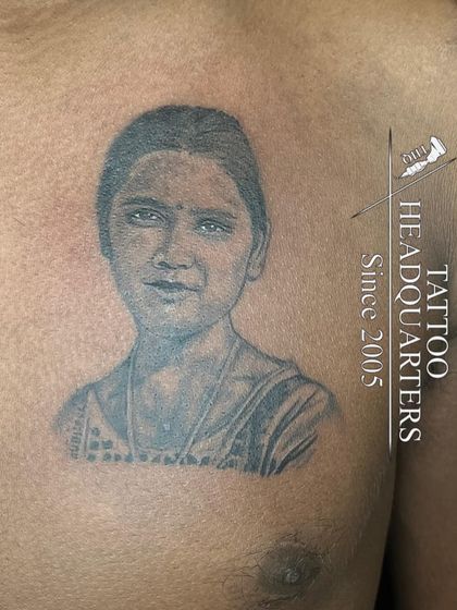 A chest portrait tattoo that captures a striking resemblance. We work from photographs to create lasting tributes to loved ones.