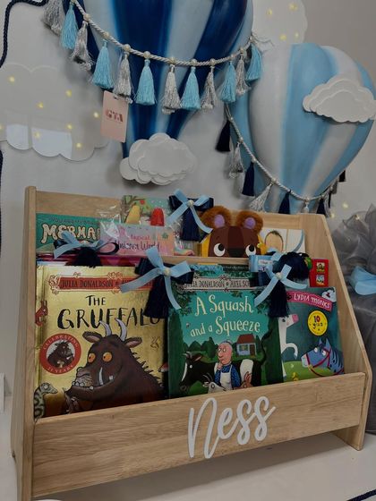 A close-up of the 'Ness' bookshelf, filled with classic children's books like 'The Gruffalo'.
