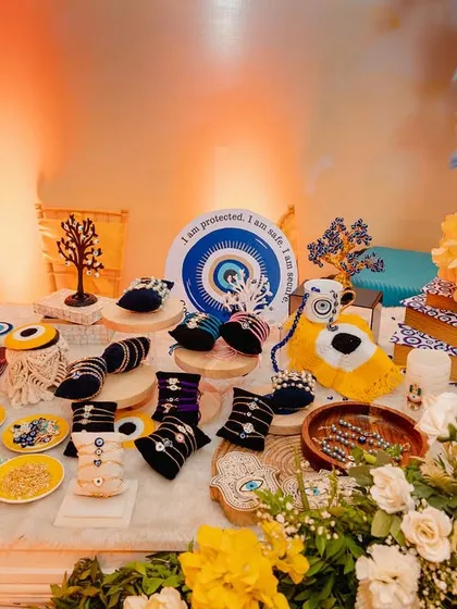 An evil-eye themed favor station, offering guests protection and good vibes. I love incorporating meaningful and trendy elements into the wedding festivities.