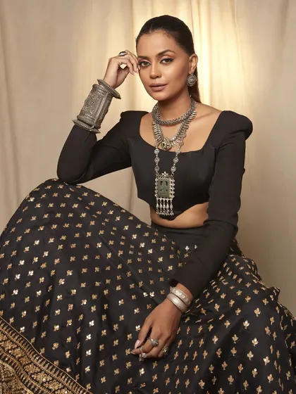 A full look from the oxidized jewelry campaign. The makeup is kept chic and minimal to allow the statement jewelry and the model's natural beauty to be the main focus.