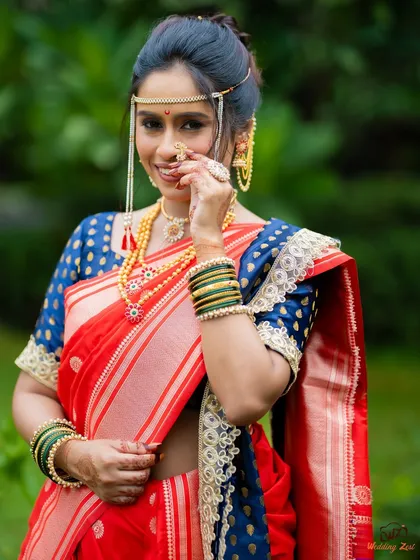 The traditional Maharashtrian nath is a statement piece. I keep the makeup elegant and understated to let the jewellery and the bride's joyful expression take center stage.