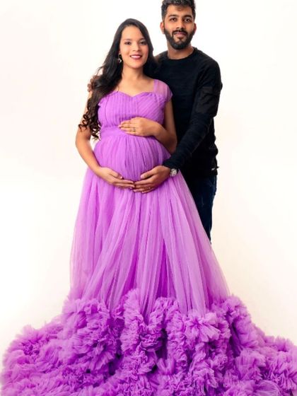 A classic couple's portrait, with the mom-to-be looking radiant in our lavender ruffled gown.