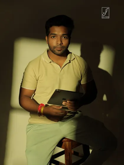 A moody and atmospheric portrait using a single light source to create a window-like shadow effect.