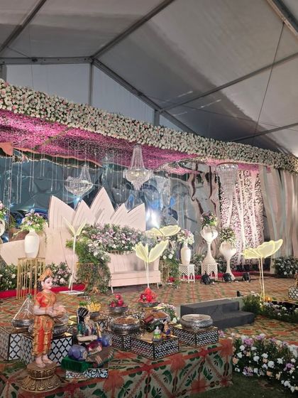 A side view of the modern lotus stage, showing the offering table and traditional dolls.