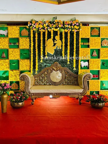 A unique checkerboard backdrop for a baby shower, featuring marigolds and a silhouette of a mother and child. This design beautifully blends traditional elements with a personal touch.