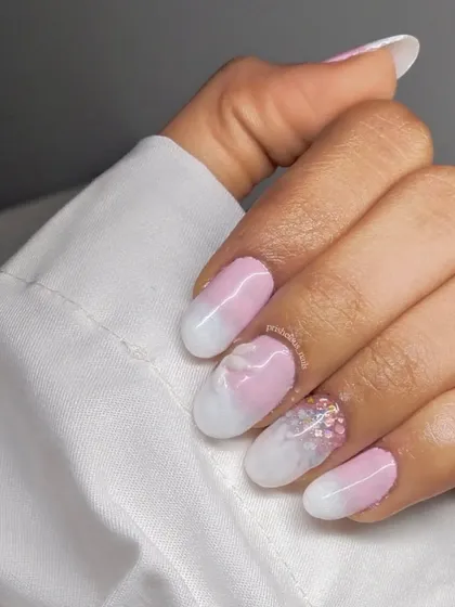 3D petal nails are so delicate and pretty. This design features an ombre of pink and white with sheer, layered petals and a touch of glitter for a soft, romantic look.