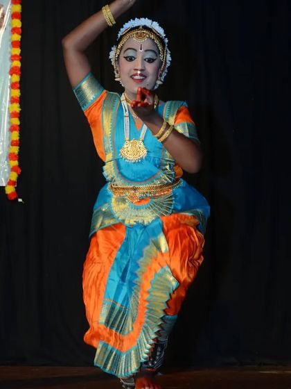 One of our students in a joyful and energetic pose during her performance at the Jhenkara festival.