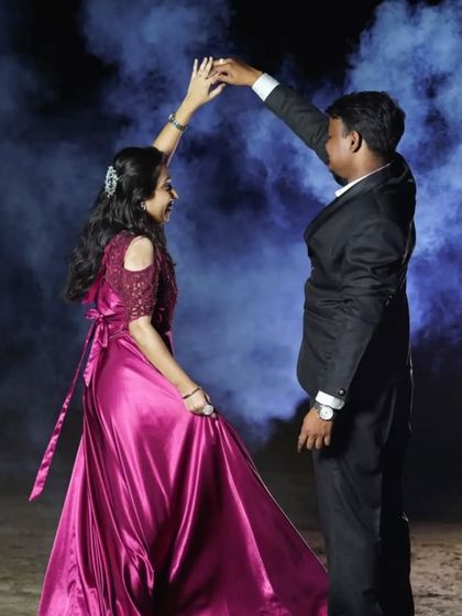 We provide coordinated outfits for any romantic occasion. This couple is ready for their anniversary dance, with her in a beautiful magenta gown and him in a sharp suit.
