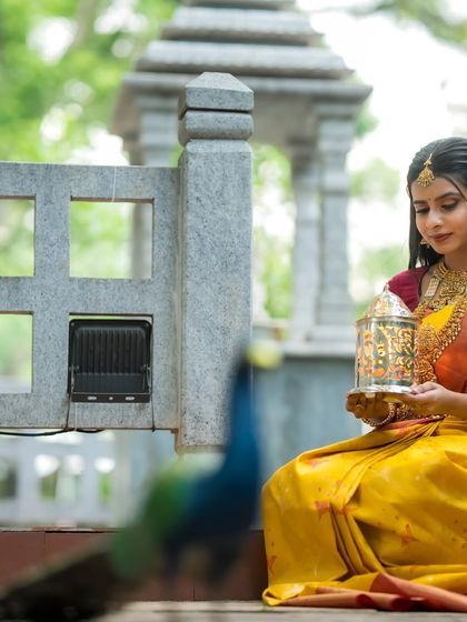 A close-up of the model holding the lantern, her expression serene and contemplative.