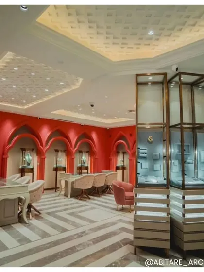 A view of the private consultation area at Batukbhai Jewellers, featuring vibrant coral walls with traditional archways. This design choice pays homage to Jaipur's craftsmanship while creating a memorable and energetic space for clients.
