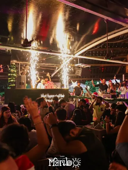 A wide shot of the Christmas celebration at Cafe Mambo, with pyrotechnics going off above the DJ booth. This shows the scale of the holiday events I handle.