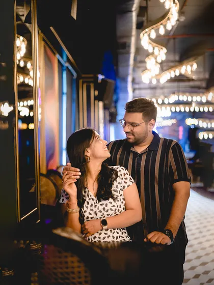 A stylish pre-wedding shoot in a trendy, well-lit cafe. I can adapt to any environment to capture modern, chic portraits that reflect the couple's lifestyle.