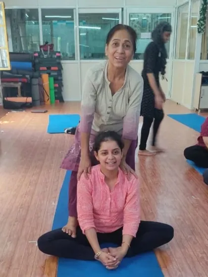 A beautiful moment between two students of different generations. Yoga brings people together, and this assisted stretch shows the supportive and caring community we have built.